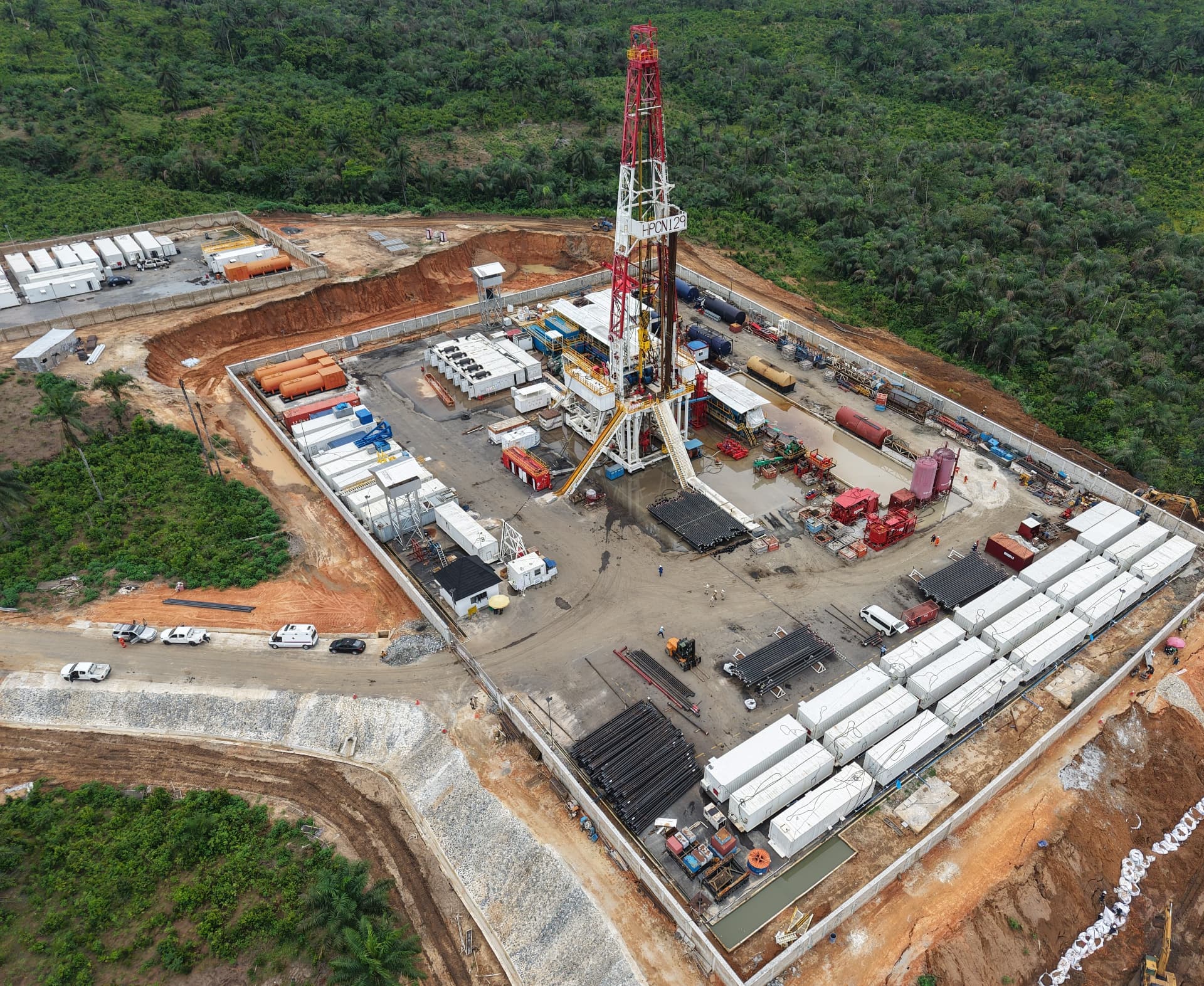 Land drilling rig HPCN 129 on location in the Niger Delta, with camp, pipe racks and support spread
